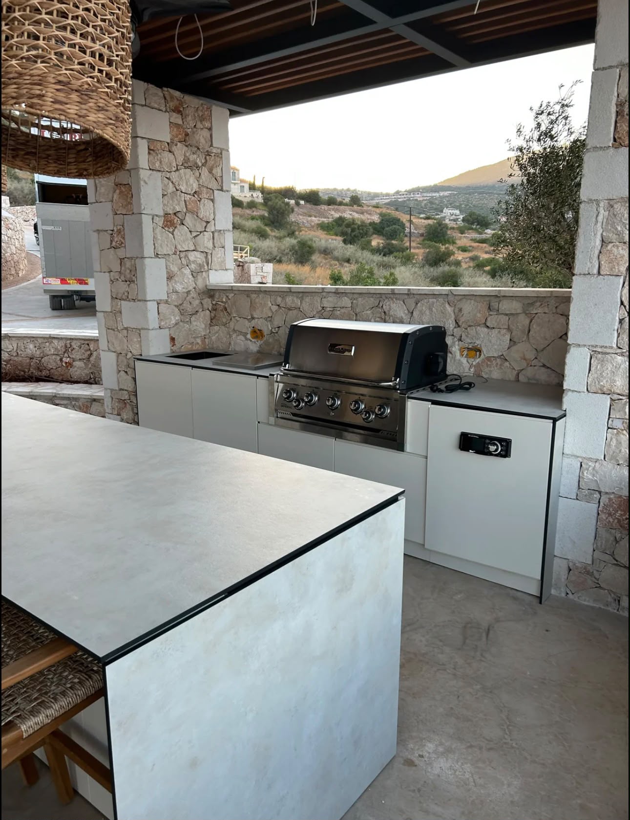 Eleexa outdoor kitchen island with Broil King grill and sea view
