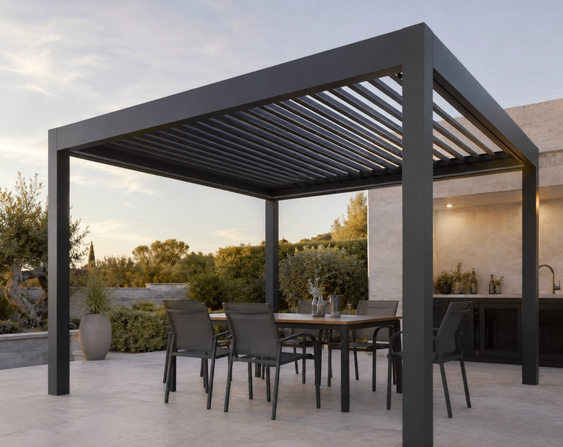 Anthracite pergola with dining table at dusk